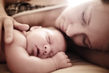 Mother and newborn sleeping together