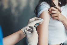 patient receiving vaccination in upper arm