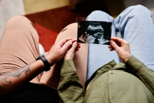 couple holding baby ultrasound