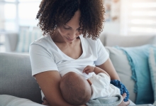 woman breastfeeding baby