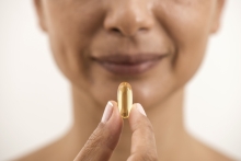 woman holding vitamin D