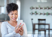 woman reading fertility article on her phone