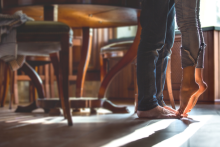 Image shows legs of a couple standing